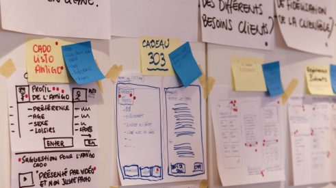 Photograph of several sketches put on papers during a design sprint